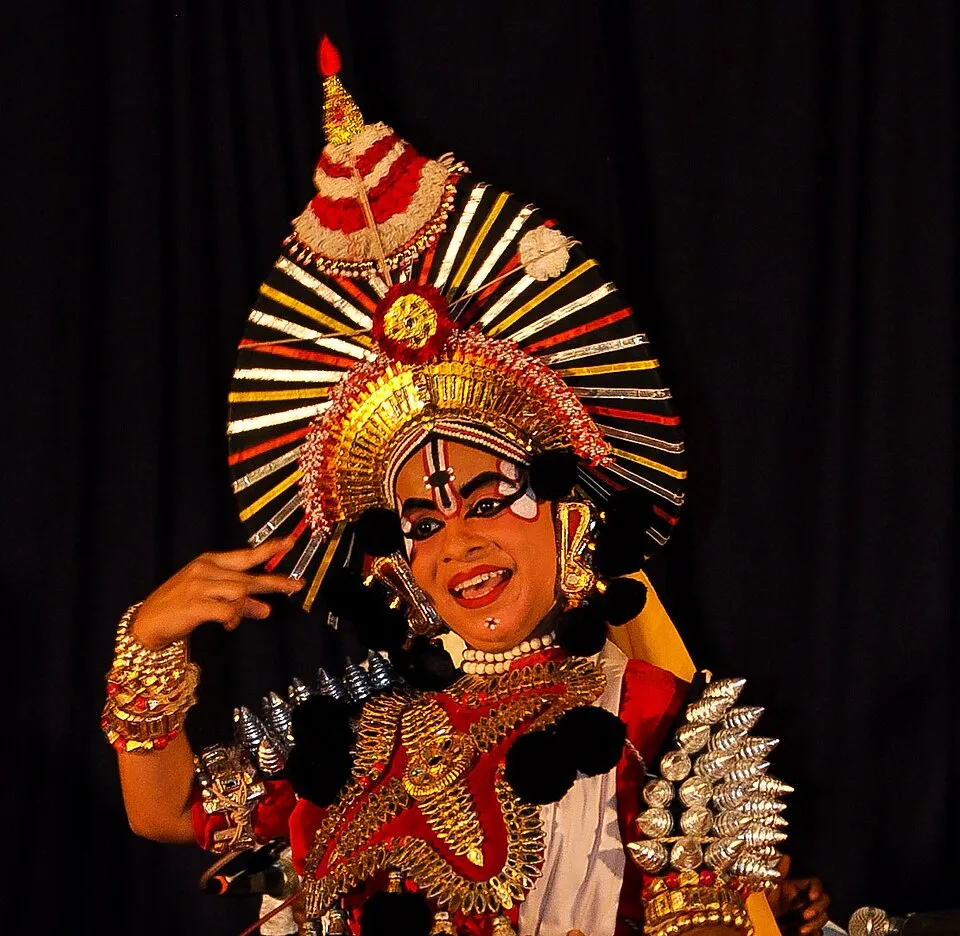 A Yakshagana performer in full costume and crown
