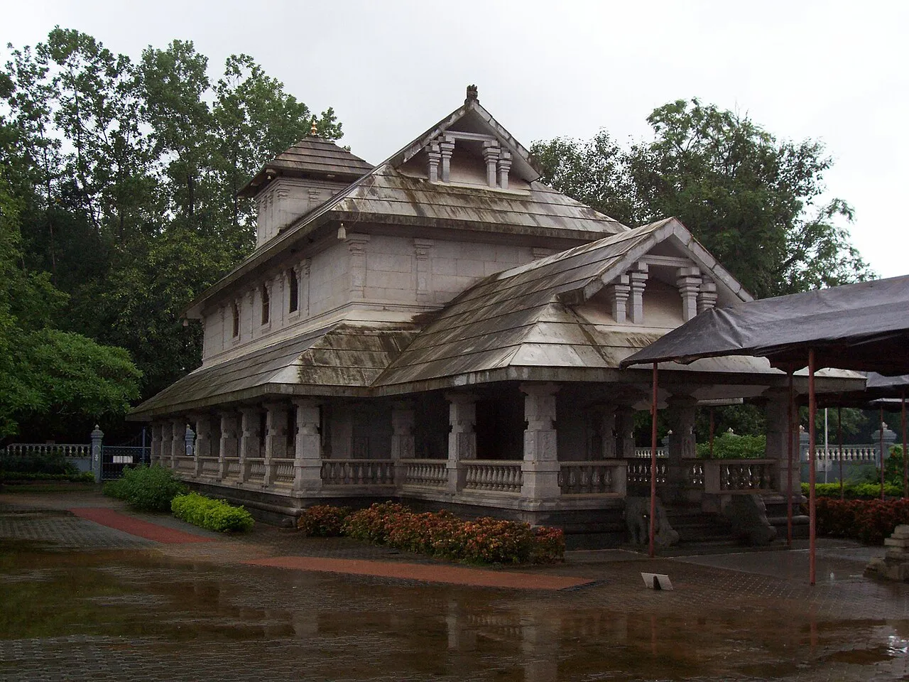 The Chandranatha basadi at Dharmasthala, a Jain temple with sloping tiled roofs among trees