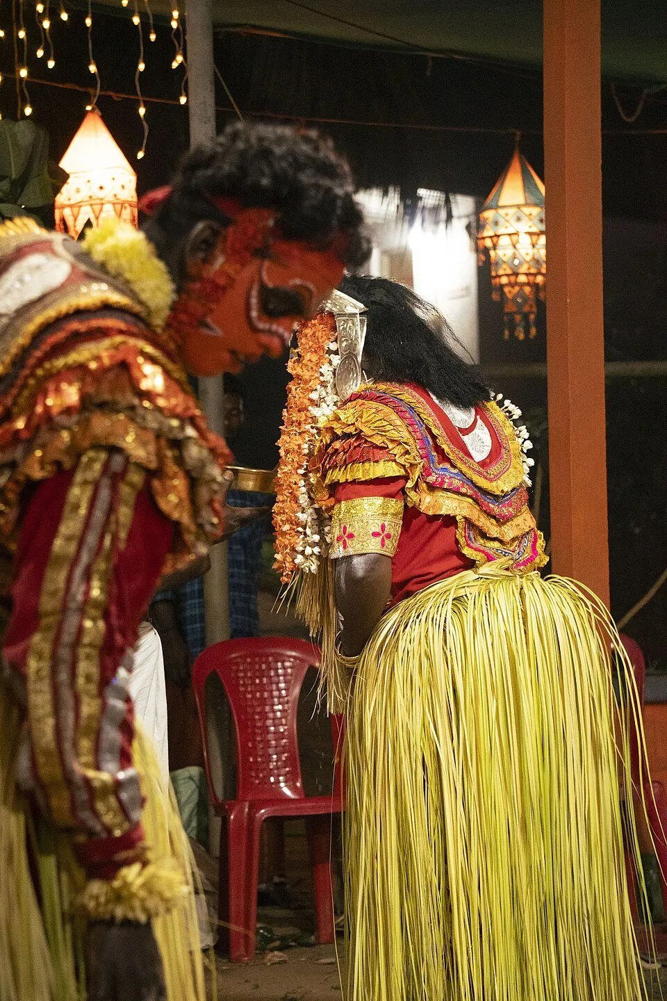Kuppe Panjurli and Kallurti, two daivas, face to face at a kola