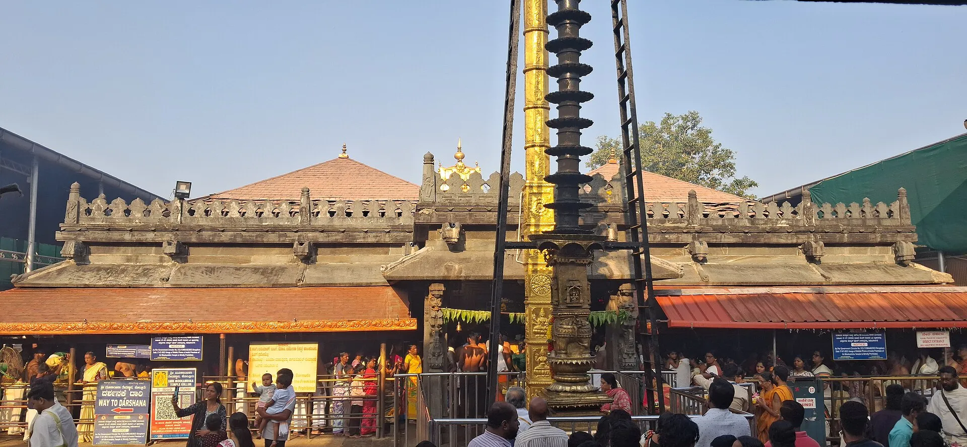 The main shrine of the Mookambika temple at Kollur, with its tall flagpole and gilded tower