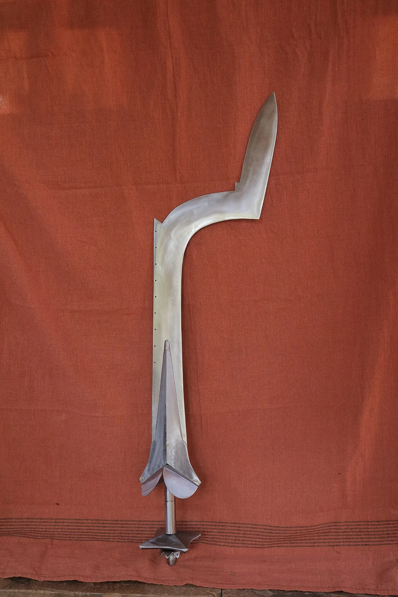 Rakteshwari's long curved sword standing against a red cloth